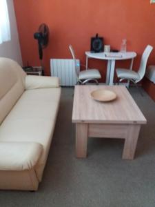 a living room with a couch and a coffee table at Apartmán Olomouc 2+KK in Olomouc