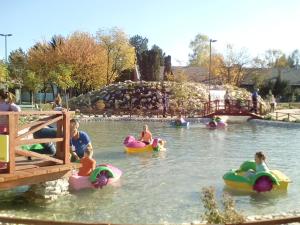 a group of children in the water at a water park at Apartment Alipašino in Sarajevo