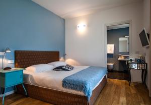 Postel nebo postele na pokoji v ubytování Spluga Sosta & Hotel