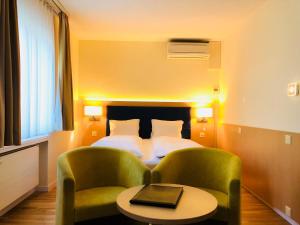 Voodi või voodid majutusasutuse Hotel Felmis toas