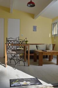 a living room with a couch and a table at Mas du Puech Cymbale in Assas