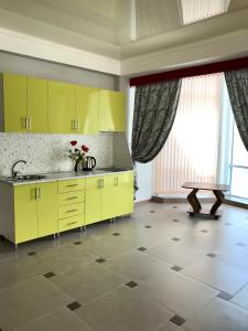 A kitchen or kitchenette at Kavkaz Hotel