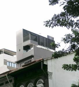 a building with a balcony on top of it at Comfy Studio 2 by Recharge in Singapore