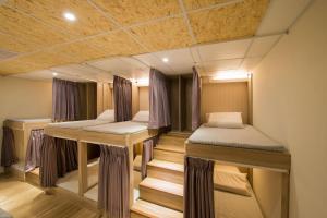 Postel nebo postele na pokoji v ubytování Hostel Jiizu