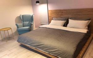 Ein Bett oder Betten in einem Zimmer der Unterkunft Less is more