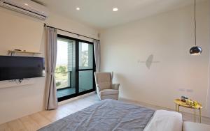 Ein Bett oder Betten in einem Zimmer der Unterkunft Less is more