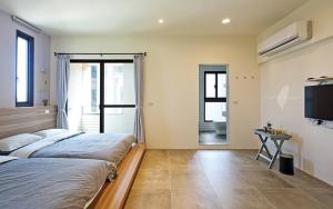 Ein Bett oder Betten in einem Zimmer der Unterkunft Less is more