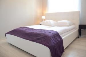 
Łóżko lub łóżka w pokoju w obiekcie Magnolia Apartment

