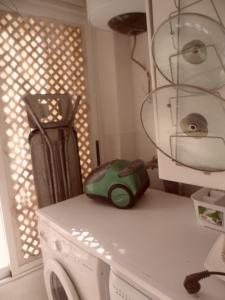 a kitchen counter with a washing machine and a window at Arcoiris in Callao Salvaje