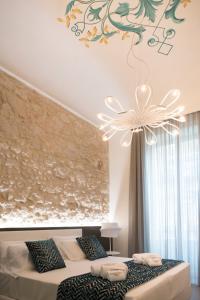 Postelja oz. postelje v sobi nastanitve Caportigia Boutique Hotel