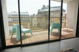 En balkon eller terrasse på Appartement Forum Reims