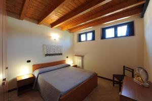 Ein Bett oder Betten in einem Zimmer der Unterkunft Casa Vacanze DalMolin