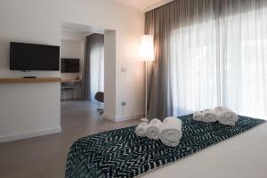 TV in/ali zabaviščno središče v nastanitvi Caportigia Boutique Hotel