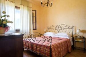A bed or beds in a room at Agriturismo L'Antica Fornace