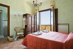 A bed or beds in a room at Agriturismo L'Antica Fornace