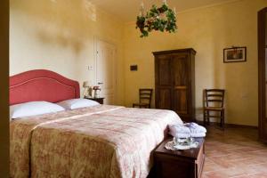 A bed or beds in a room at Agriturismo L'Antica Fornace