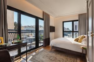 Rúm í herbergi á Hotel Jacob Samuel by Prima Hotels