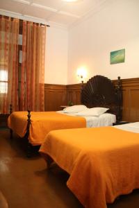 Säng eller sängar i ett rum på Monte Sinai Guest House