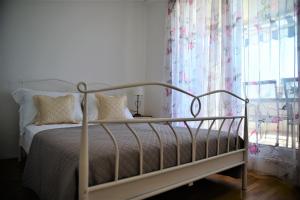 Posteľ alebo postele v izbe v ubytovaní Apartman Lucita