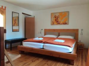 a bedroom with a large bed in a room at Apartment Krnica N43 in Krnica