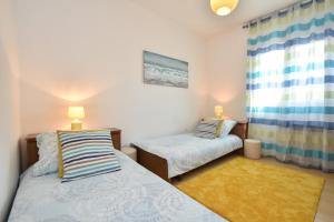 Postel nebo postele na pokoji v ubytování Apartment Bezic