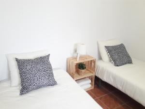 Łóżko lub łóżka w pokoju w obiekcie CH Apartments