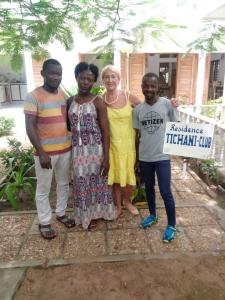a group of people posing for a picture at Résidence Tichani Club in Cotonou
