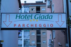 a sign for a hotel gloria paracethews at Hotel Giada in Turin