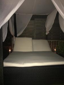 מיטה או מיטות בחדר ב-Nico Zen Home