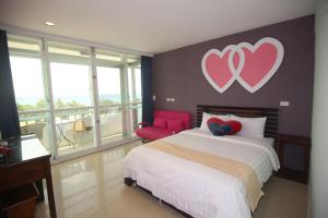 Postel nebo postele na pokoji v ubytování Kenting Waterfront Hotel