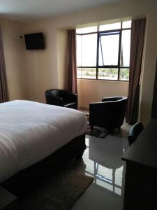 Mara Frontier Hotel客房内的一张或多张床位