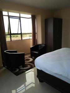 Mara Frontier Hotel客房内的一张或多张床位