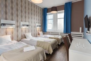 Hotel Traffic Poznań Stare Miasto客房内的一张或多张床位