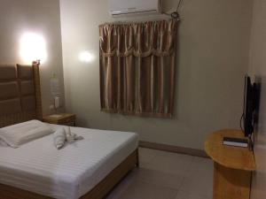 Ein Bett oder Betten in einem Zimmer der Unterkunft Asia Novo Boutique Hotel - Oroquieta