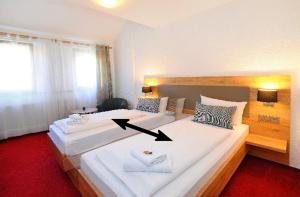 Postel nebo postele na pokoji v ubytování Vico's Hotel & Restaurant Asperg
