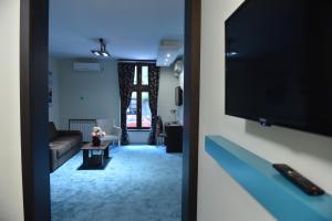 TV a/nebo společenská místnost v ubytování City Code In Joy