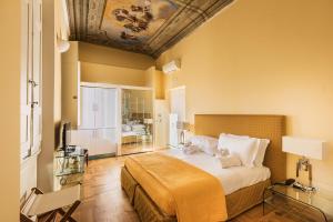 Postel nebo postele na pokoji v ubytování Hotel la Scala