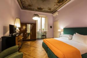 Postel nebo postele na pokoji v ubytování Hotel la Scala