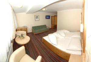 Posteľ alebo postele v izbe v ubytovaní ARBOR Hotel & Apartments