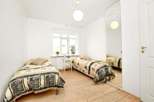 Posteľ alebo postele v izbe v ubytovan&iacute; Alfred's Apartments