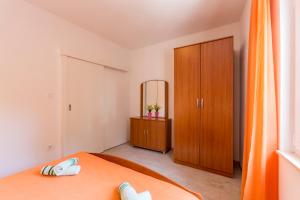 Ein Bett oder Betten in einem Zimmer der Unterkunft Apartments Petra