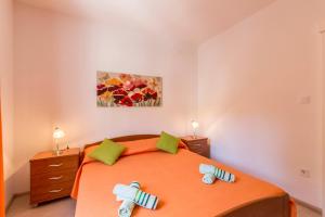 Ein Bett oder Betten in einem Zimmer der Unterkunft Apartments Petra