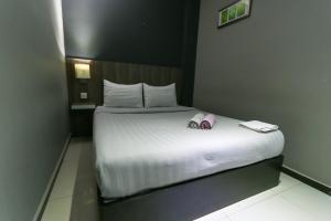 Ένα ή περισσότερα κρεβάτια σε δωμάτιο στο Hotel 99 Botanik Klang