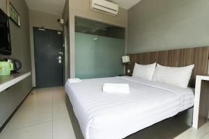 Ένα ή περισσότερα κρεβάτια σε δωμάτιο στο Hotel 99 Botanik Klang