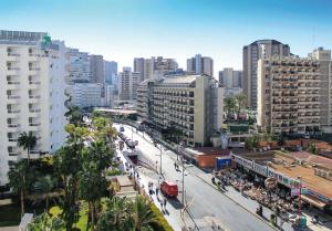 a city with a busy street in front of buildings at Apartamentos Gema - Gemelos 26 in Benidorm