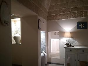 a bathroom with a urinal and a window in a room at Casa Carlotta in Monopoli +59 photos