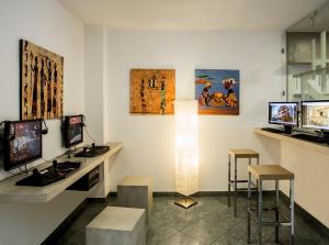 TV a/nebo společenská místnost v ubytování Hotel Giulietta