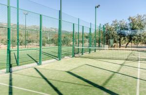 a tennis court with two tennis nets on it at Hotel Rural Los Nogales in Pozo Alcón