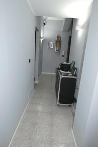 a hallway with a room with a printer in it at B&B enjoy music in Villa San Giovanni
