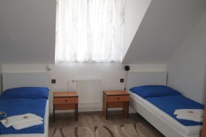 Postel nebo postele na pokoji v ubytování Labe Aréna Račice